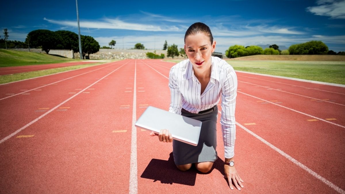 How Fast Does SEO Work - Woman at a Low Start Carrying a Laptop